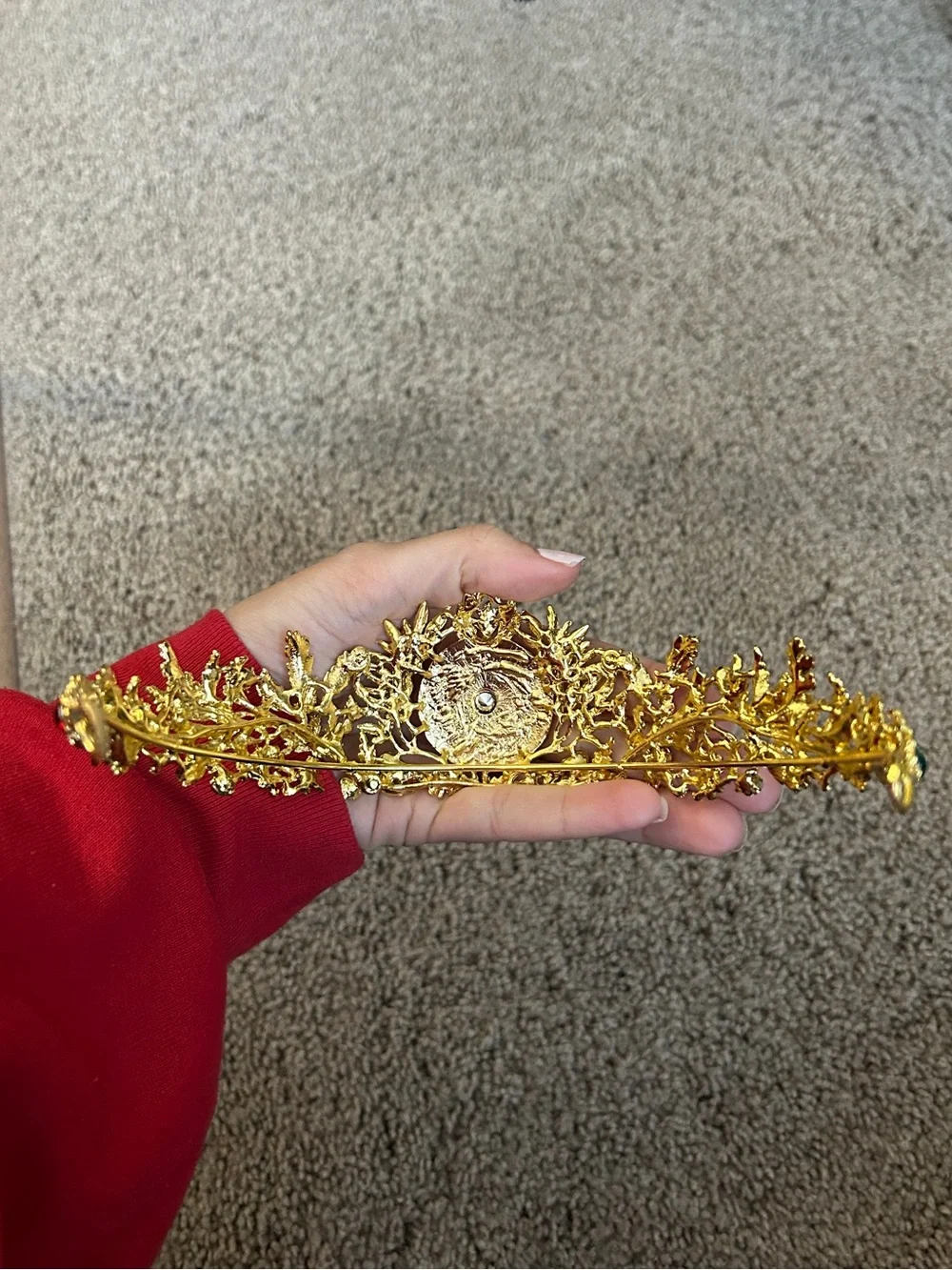 Gold colored crown headband with red and green faux gemstones